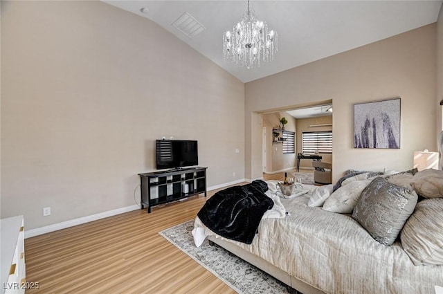 8223 Saddleback Ledge Ave, Las Vegas, NV 89147 - bedroom featuring wood finished floors, baseboards, a chandelier, and high vaulted ceiling
