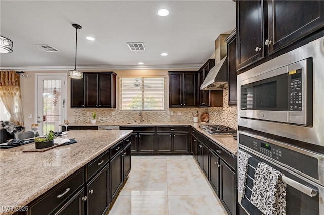 8223 Saddleback Ledge Ave, Las Vegas, NV 89147 - kitchen featuring appliances with stainless steel finishes, a sink, plenty of natural light, ornamental molding, and backsplash
