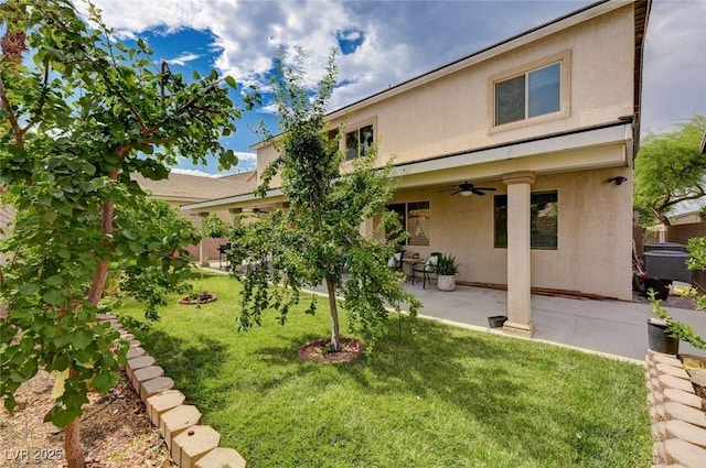 8223 Saddleback Ledge Ave, Las Vegas, NV 89147 - back of property featuring ceiling fan, stucco siding, a yard, and a patio