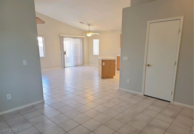 4718 Victoria Garden Ave, North Las Vegas, NV 89031 - unfurnished room with ceiling fan, lofted ceiling, baseboards, and light tile patterned flooring