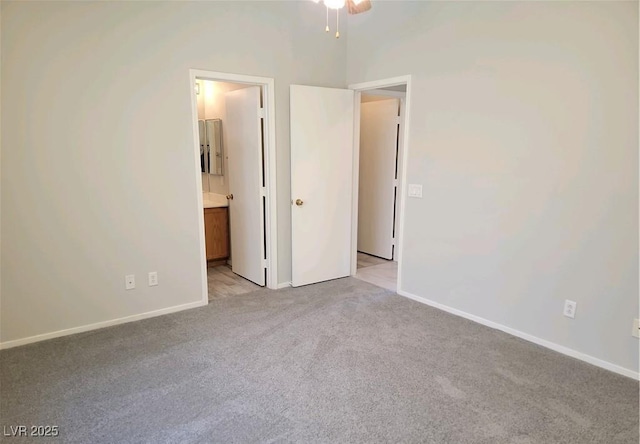 4718 Victoria Garden Ave, North Las Vegas, NV 89031 - unfurnished bedroom featuring light carpet, baseboards, and connected bathroom