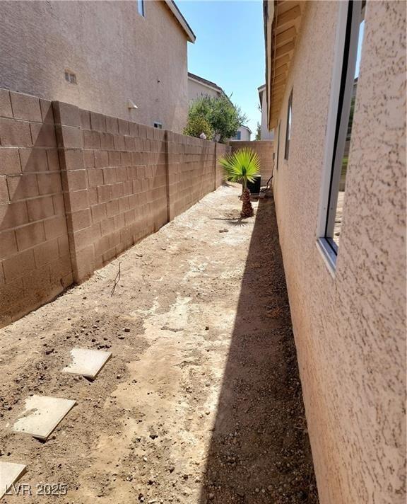4718 Victoria Garden Ave, North Las Vegas, NV 89031 - view of home's exterior featuring stucco siding and a fenced backyard
