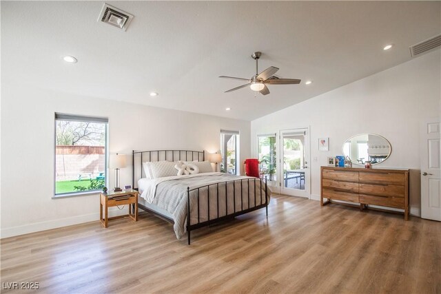 3236 Cliff Sieler Ct, Las Vegas, NV 89117 - bedroom featuring access to exterior, multiple windows, light wood finished floors, recessed lighting, and vaulted ceiling