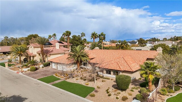 3236 Cliff Sieler Ct, Las Vegas, NV 89117 - view of front of home featuring a residential view, a tile roof, stucco siding, a garage, and driveway