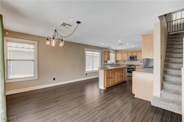 3717 Shanagolden St, Las Vegas, NV 89129 - kitchen featuring stainless steel appliances, light brown cabinets, baseboards, dark wood-type flooring, and recessed lighting