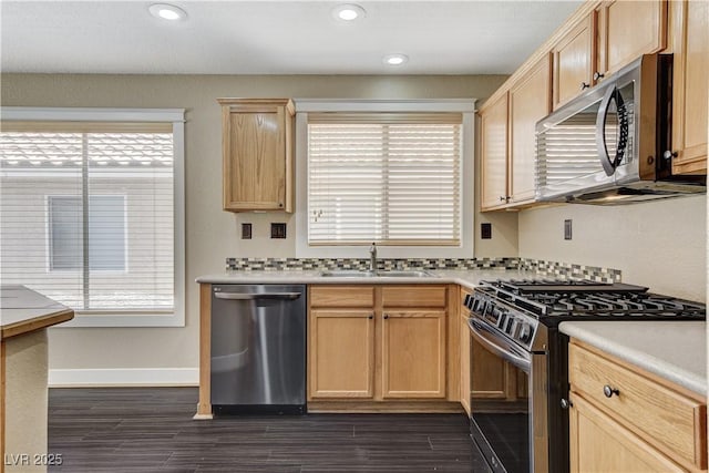 3717 Shanagolden St, Las Vegas, NV 89129 - kitchen with appliances with stainless steel finishes, a sink, light brown cabinets, plenty of natural light, and recessed lighting