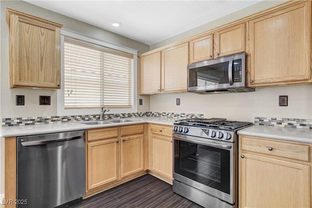 3717 Shanagolden St, Las Vegas, NV 89129 - kitchen featuring appliances with stainless steel finishes, light brown cabinetry, and recessed lighting