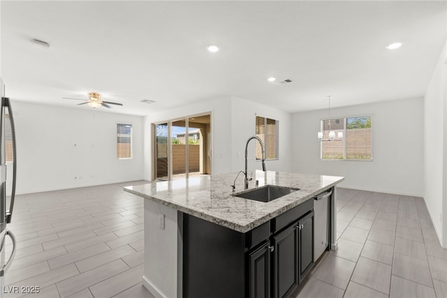767 Tallgrass St, Las Vegas, NV 89138 - kitchen featuring a sink, dark cabinetry, dishwasher, open floor plan, and ceiling fan