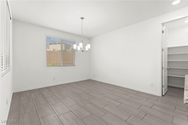 767 Tallgrass St, Las Vegas, NV 89138 - unfurnished dining area with a chandelier, recessed lighting, and baseboards
