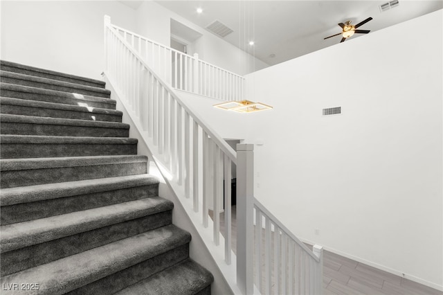 767 Tallgrass St, Las Vegas, NV 89138 - stairs with wood finished floors, ceiling fan, baseboards, recessed lighting, and a towering ceiling