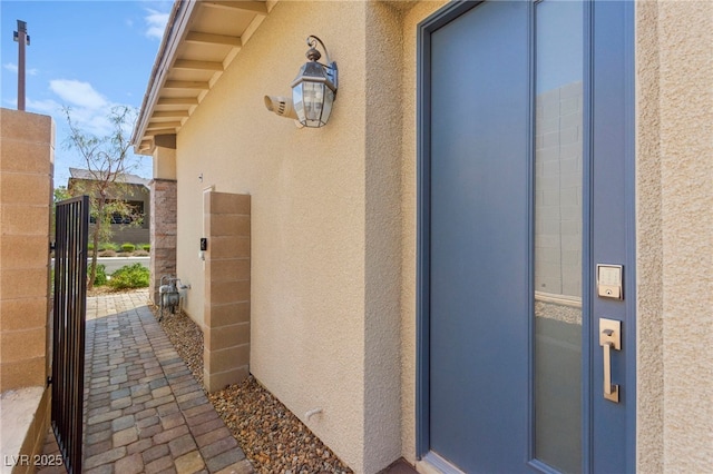 767 Tallgrass St, Las Vegas, NV 89138 - entrance to property featuring stucco siding, elevator, and a gate