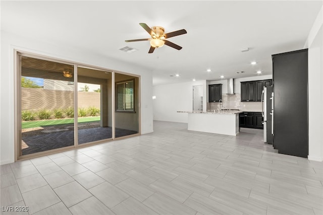767 Tallgrass St, Las Vegas, NV 89138 - unfurnished living room featuring a ceiling fan, recessed lighting, and a sink