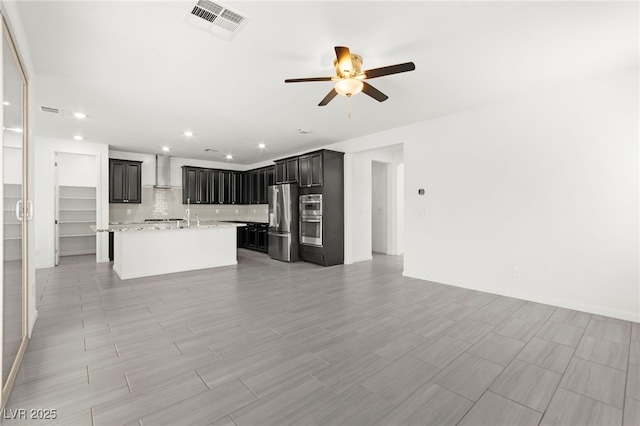 767 Tallgrass St, Las Vegas, NV 89138 - kitchen with appliances with stainless steel finishes, wall chimney range hood, open floor plan, recessed lighting, and ceiling fan