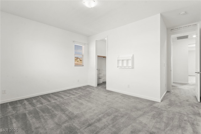 767 Tallgrass St, Las Vegas, NV 89138 - unfurnished bedroom with carpet floors, baseboards, and a walk in closet