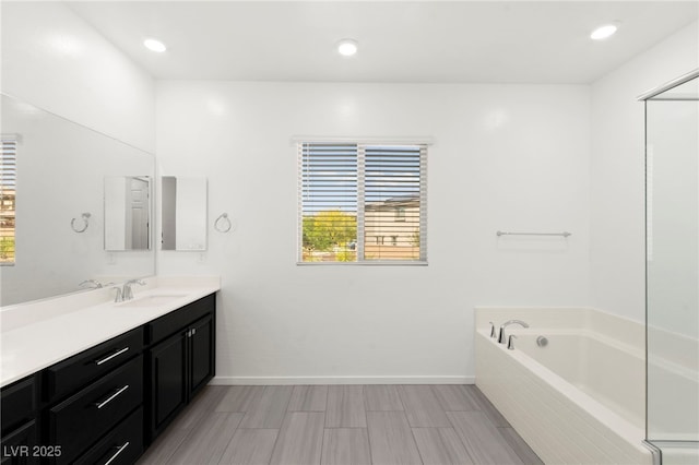 767 Tallgrass St, Las Vegas, NV 89138 - full bath featuring vanity, a bath, baseboards, and recessed lighting