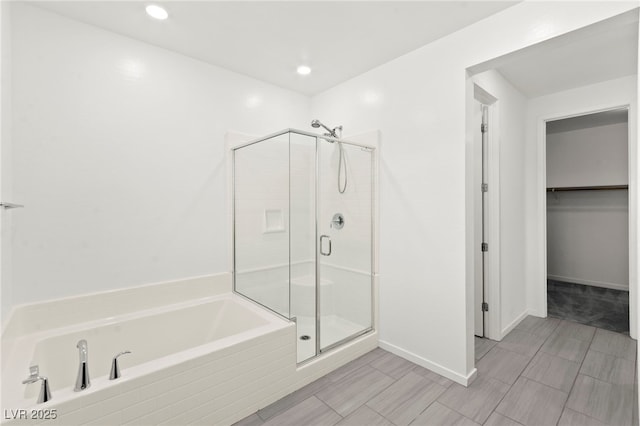 767 Tallgrass St, Las Vegas, NV 89138 - full bath with a shower stall, a garden tub, a walk in closet, baseboards, and recessed lighting