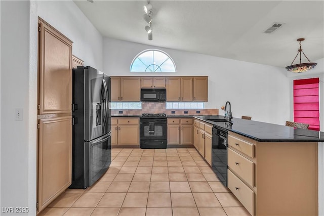 6405 Break Point Ave, Las Vegas, NV 89130 - kitchen with black appliances, a sink, a peninsula, dark countertops, and decorative backsplash