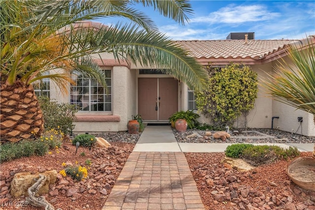 6405 Break Point Ave, Las Vegas, NV 89130 - property entrance featuring stucco siding and a tiled roof