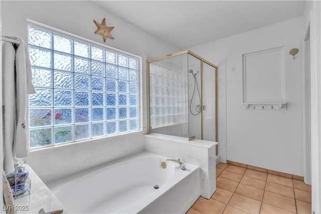 6405 Break Point Ave, Las Vegas, NV 89130 - bathroom with a garden tub, a stall shower, and tile patterned flooring