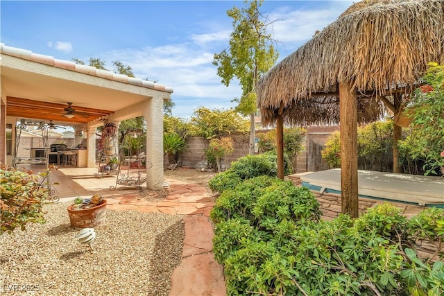 6405 Break Point Ave, Las Vegas, NV 89130 - fenced backyard with a ceiling fan and a patio