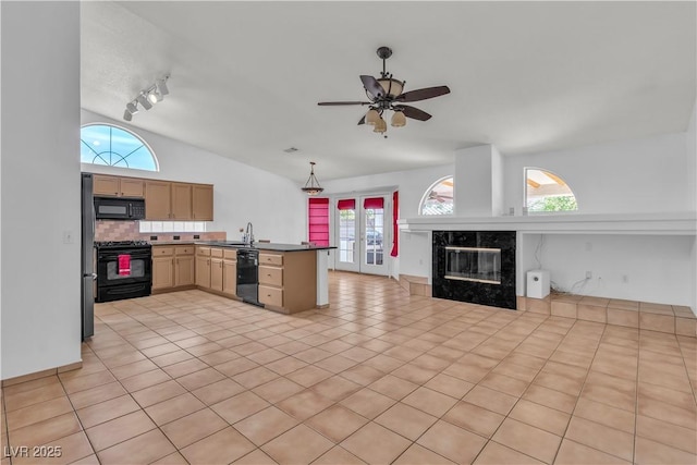6405 Break Point Ave, Las Vegas, NV 89130 - kitchen with black appliances, vaulted ceiling, a peninsula, open floor plan, and a ceiling fan
