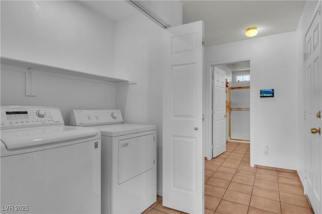 6405 Break Point Ave, Las Vegas, NV 89130 - laundry room with washing machine and dryer and light tile patterned flooring