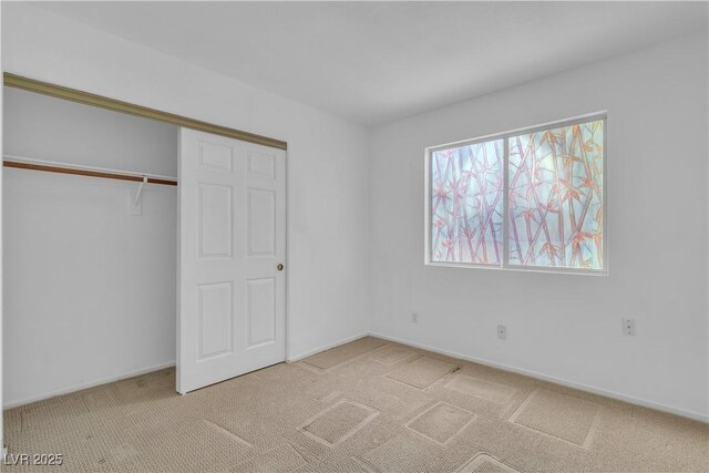 6405 Break Point Ave, Las Vegas, NV 89130 - unfurnished bedroom with carpet floors, a closet, and baseboards