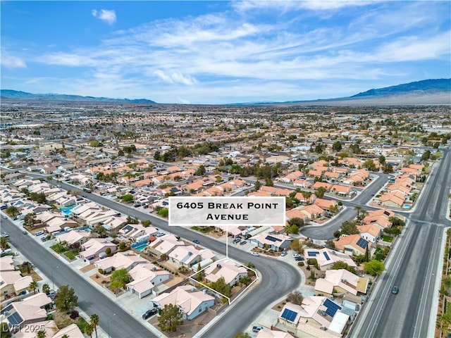 6405 Break Point Ave, Las Vegas, NV 89130 - aerial view of property and surrounding area with a mountain backdrop and nearby suburban area
