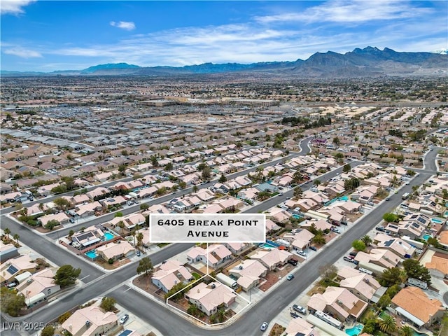 6405 Break Point Ave, Las Vegas, NV 89130 - aerial view of property and surrounding area featuring a mountain backdrop and nearby suburban area