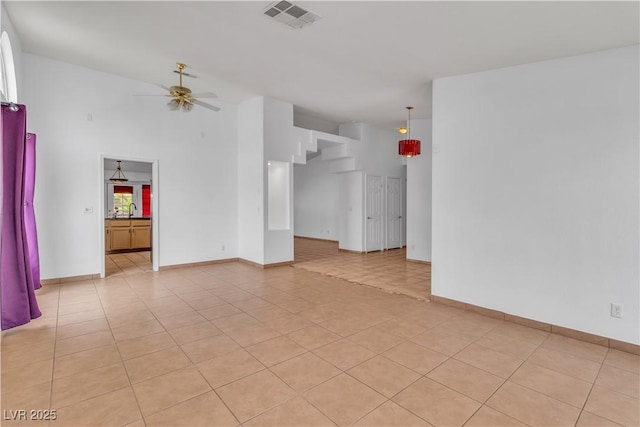 6405 Break Point Ave, Las Vegas, NV 89130 - spare room featuring ceiling fan, light tile patterned flooring, baseboards, and high vaulted ceiling