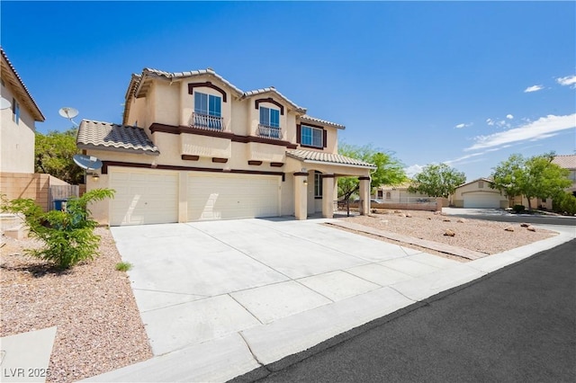8224 Cassis Ct, Las Vegas, NV 89117 - mediterranean / spanish-style home with a garage, a balcony, stucco siding, and driveway