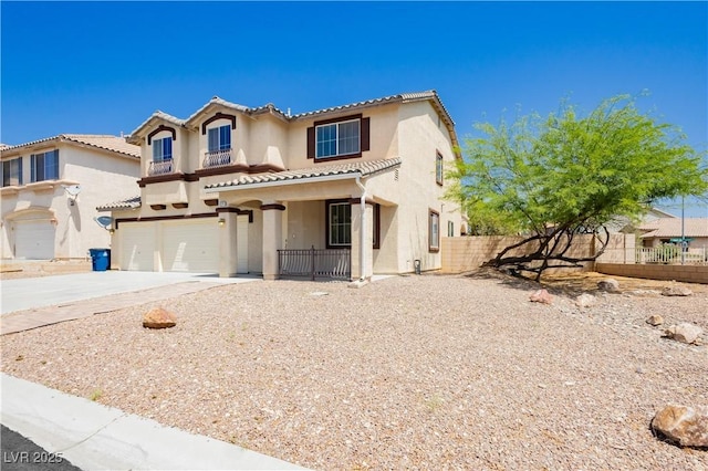 8224 Cassis Ct, Las Vegas, NV 89117 - mediterranean / spanish home with an attached garage, stucco siding, driveway, a tile roof, and covered porch