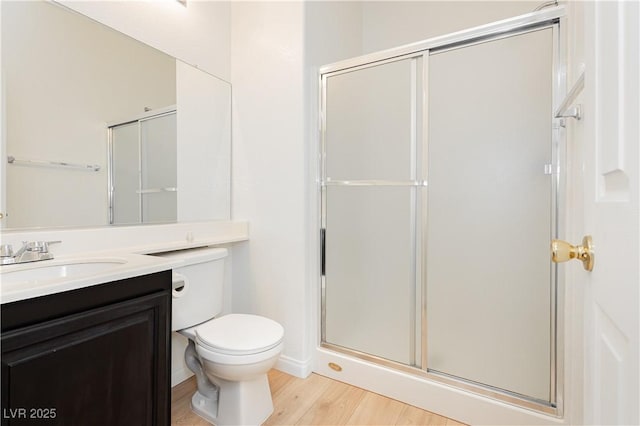 8224 Cassis Ct, Las Vegas, NV 89117 - full bath with wood finished floors, a stall shower, vanity, and toilet