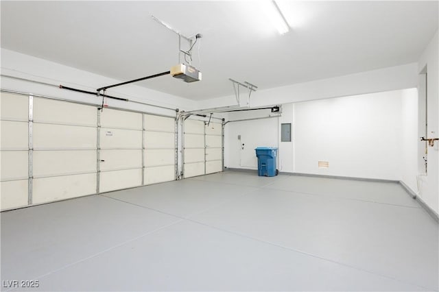 8224 Cassis Ct, Las Vegas, NV 89117 - garage featuring a garage door opener and electric panel