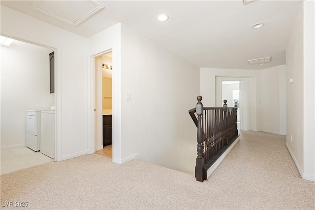8224 Cassis Ct, Las Vegas, NV 89117 - corridor featuring washing machine and dryer, an upstairs landing, carpet, recessed lighting, and baseboards
