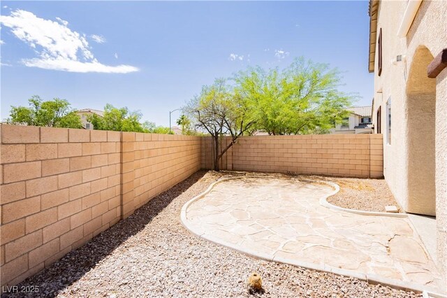 8224 Cassis Ct, Las Vegas, NV 89117 - fenced backyard featuring a patio