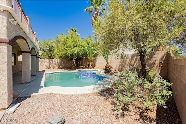 8224 Cassis Ct, Las Vegas, NV 89117 - view of swimming pool featuring a fenced backyard and a pool with connected hot tub