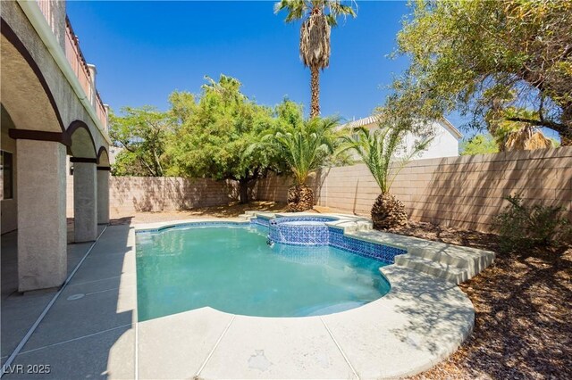 8224 Cassis Ct, Las Vegas, NV 89117 - view of pool with a fenced backyard, a pool with connected hot tub, and a patio area