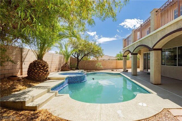8224 Cassis Ct, Las Vegas, NV 89117 - view of swimming pool featuring a fenced backyard, a patio area, and a pool with connected hot tub