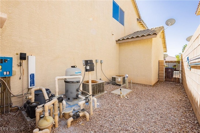 8224 Cassis Ct, Las Vegas, NV 89117 - rear view of property with stucco siding, a gate, and a tiled roof