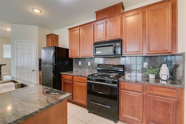 1370 Crystal Hill Ln Unit 3, Henderson, NV 89012 - kitchen featuring black appliances, tasteful backsplash, light tile patterned floors, and dark stone countertops