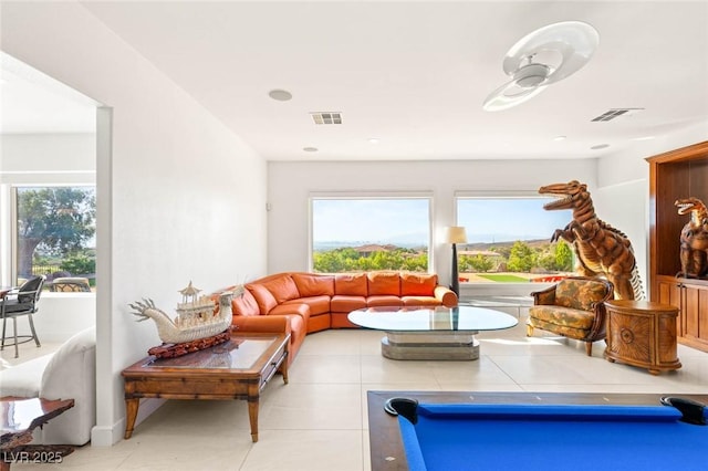 20 Kittansett Loop, Henderson, NV 89052 - living area featuring plenty of natural light and light tile patterned floors