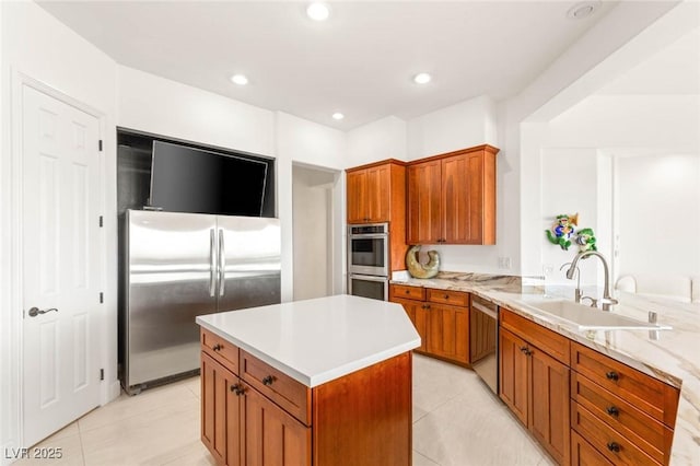 20 Kittansett Loop, Henderson, NV 89052 - kitchen with stainless steel appliances, brown cabinets, light tile patterned floors, and recessed lighting
