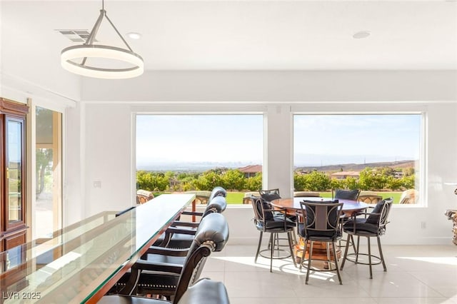 20 Kittansett Loop, Henderson, NV 89052 - dining space featuring light tile patterned floors, plenty of natural light, and recessed lighting