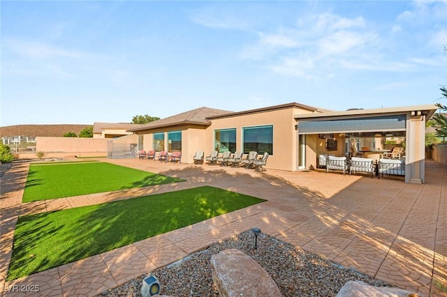 20 Kittansett Loop, Henderson, NV 89052 - back of property featuring a patio area and stucco siding