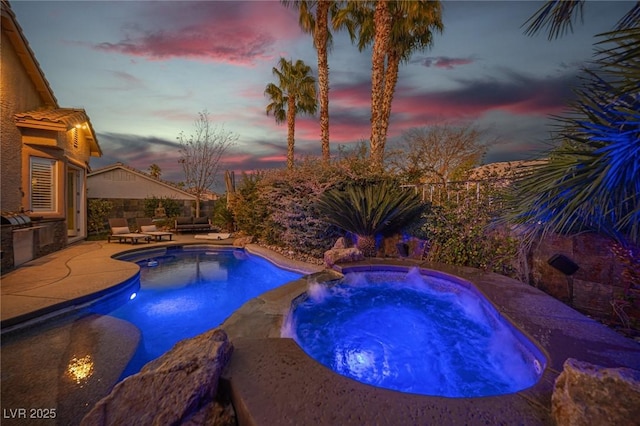 340 Autumn Palace Ct, Las Vegas, NV 89144 - view of swimming pool with a patio area, exterior kitchen, and a pool with connected hot tub