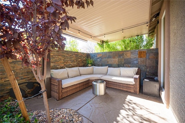 340 Autumn Palace Ct, Las Vegas, NV 89144 - fenced backyard featuring an outdoor hangout area and a patio area