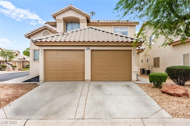 7566 Glowing Ember Ct Unit 101, Las Vegas, NV 89130 - mediterranean / spanish house with an attached garage, concrete driveway, stucco siding, and cooling unit