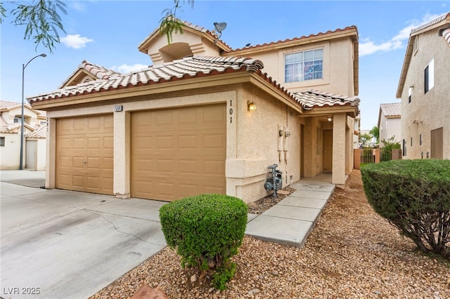 7566 Glowing Ember Ct Unit 101, Las Vegas, NV 89130 - view of front of property with stucco siding, driveway, a tiled roof, and a garage