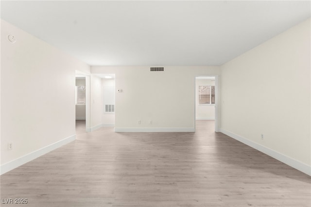 7566 Glowing Ember Ct Unit 101, Las Vegas, NV 89130 - spare room with baseboards and light wood-style flooring